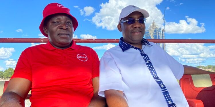 Absa Bank Director Marketing and Corporate Affairs Mato Shimabale with FAZ President Andrew Kamanga